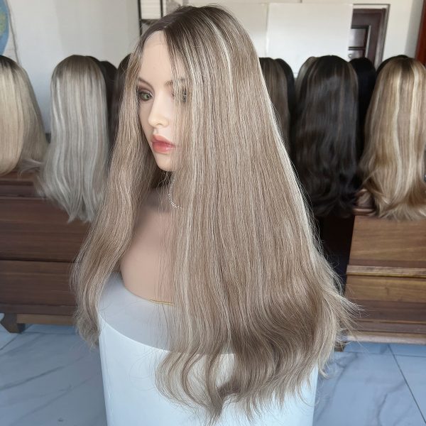 A 24-inch lace top wig made from 100% Virgin Human Hair, showcasing dark roots that transition into ash blonde with platinum blonde highlights. Sleek, flowing texture with a natural scalp effect.