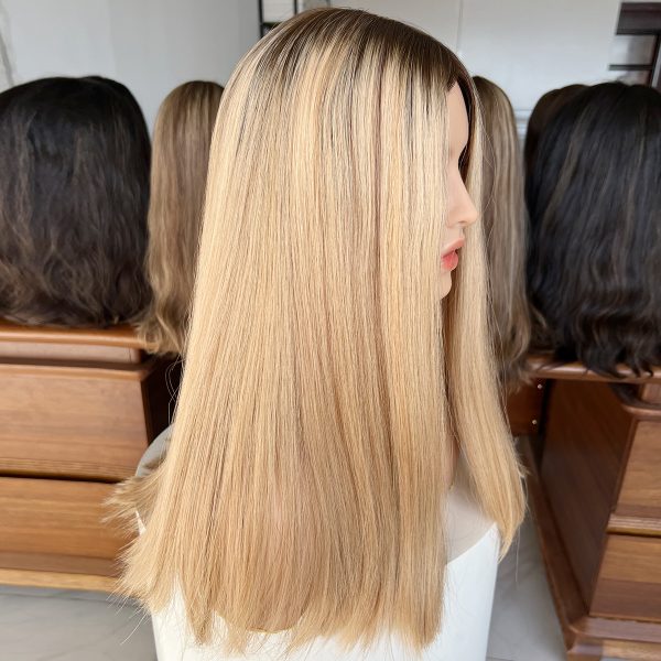 Experience luxury with the Golden Luxe Silk Top Lace Wig, crafted from 100% Virgin Human Hair. This 20-inch wig features a silk top and lace base for a natural scalp effect, sleek straight texture, and radiant blonde tone, perfect for elegant and versatile styling.
