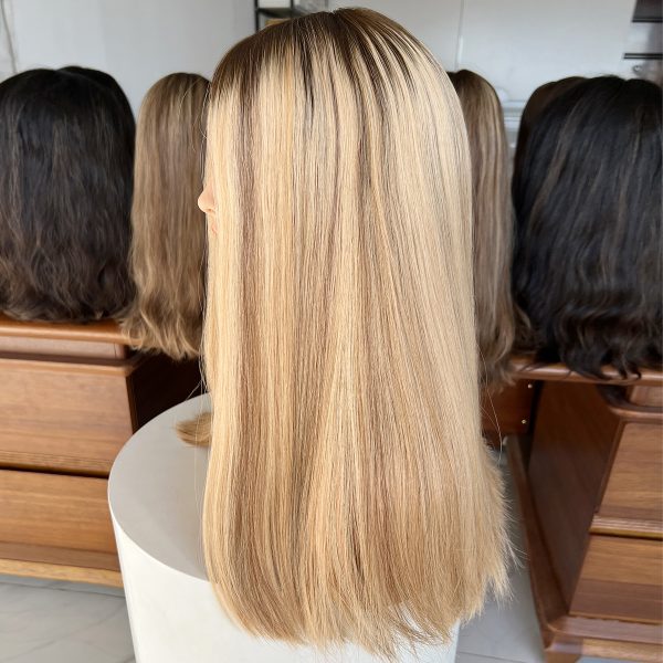 Experience luxury with the Golden Luxe Silk Top Lace Wig, crafted from 100% Virgin Human Hair. This 20-inch wig features a silk top and lace base for a natural scalp effect, sleek straight texture, and radiant blonde tone, perfect for elegant and versatile styling.