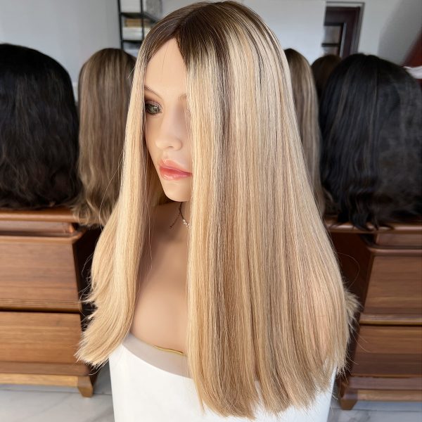 Experience luxury with the Golden Luxe Silk Top Lace Wig, crafted from 100% Virgin Human Hair. This 20-inch wig features a silk top and lace base for a natural scalp effect, sleek straight texture, and radiant blonde tone, perfect for elegant and versatile styling.
