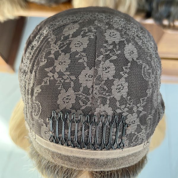 Experience luxury with the Golden Luxe Silk Top Lace Wig, crafted from 100% Virgin Human Hair. This 20-inch wig features a silk top and lace base for a natural scalp effect, sleek straight texture, and radiant blonde tone, perfect for elegant and versatile styling.