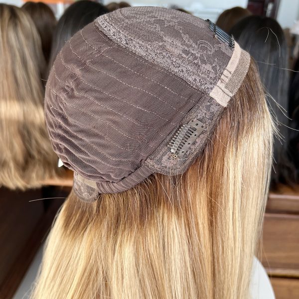Experience luxury with the Golden Luxe Silk Top Lace Wig, crafted from 100% Virgin Human Hair. This 20-inch wig features a silk top and lace base for a natural scalp effect, sleek straight texture, and radiant blonde tone, perfect for elegant and versatile styling.