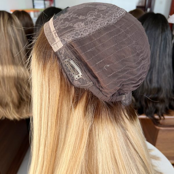 Experience luxury with the Golden Luxe Silk Top Lace Wig, crafted from 100% Virgin Human Hair. This 20-inch wig features a silk top and lace base for a natural scalp effect, sleek straight texture, and radiant blonde tone, perfect for elegant and versatile styling.