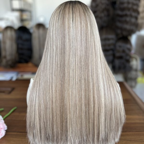 Skin top blonde wig in #8D/60, featuring deep golden blonde with platinum highlights, crafted from 100% human hair for a natural look.